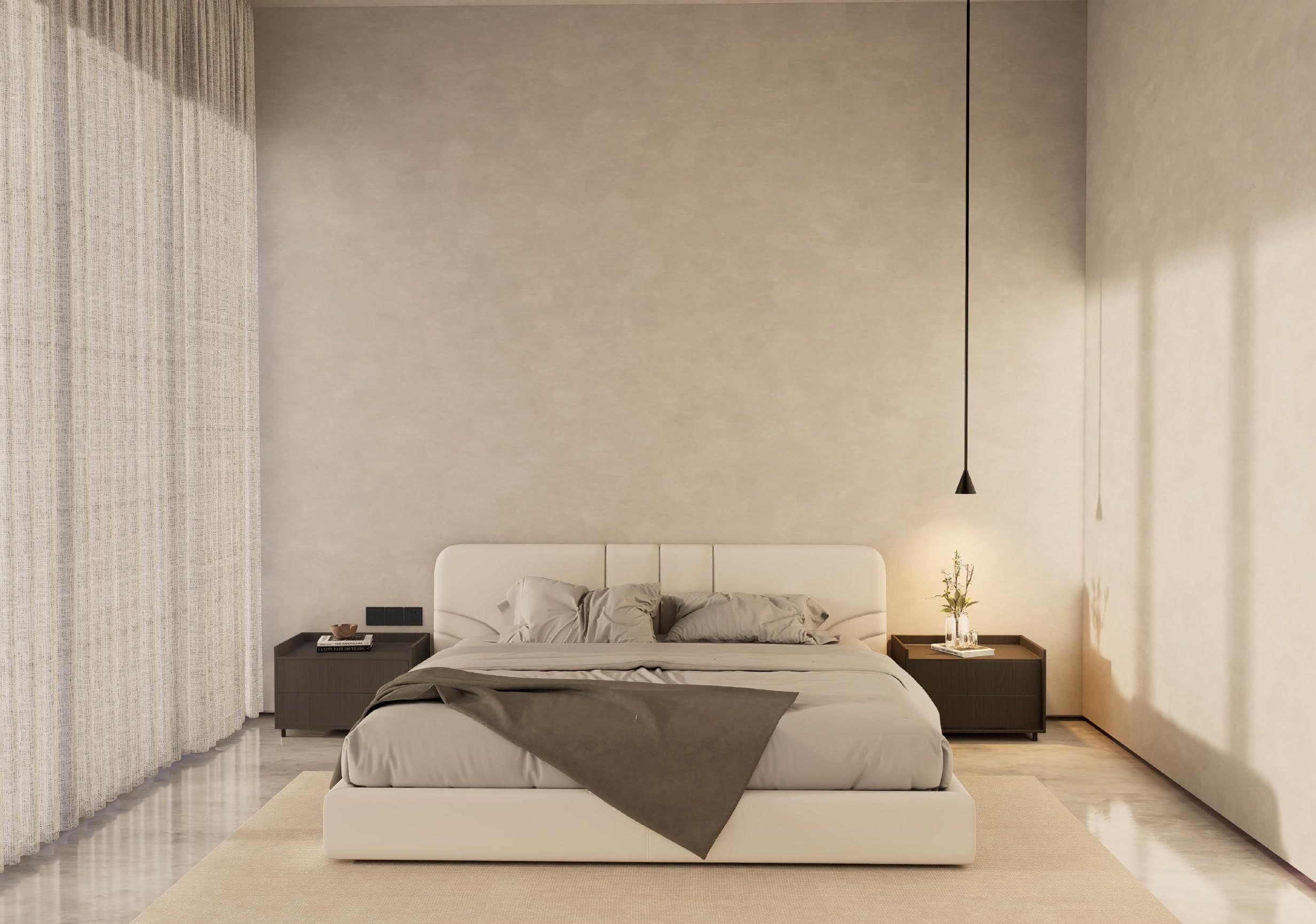 Bedroom with a curved padded headboard between dark timber bedsides, under a single dropped pendant