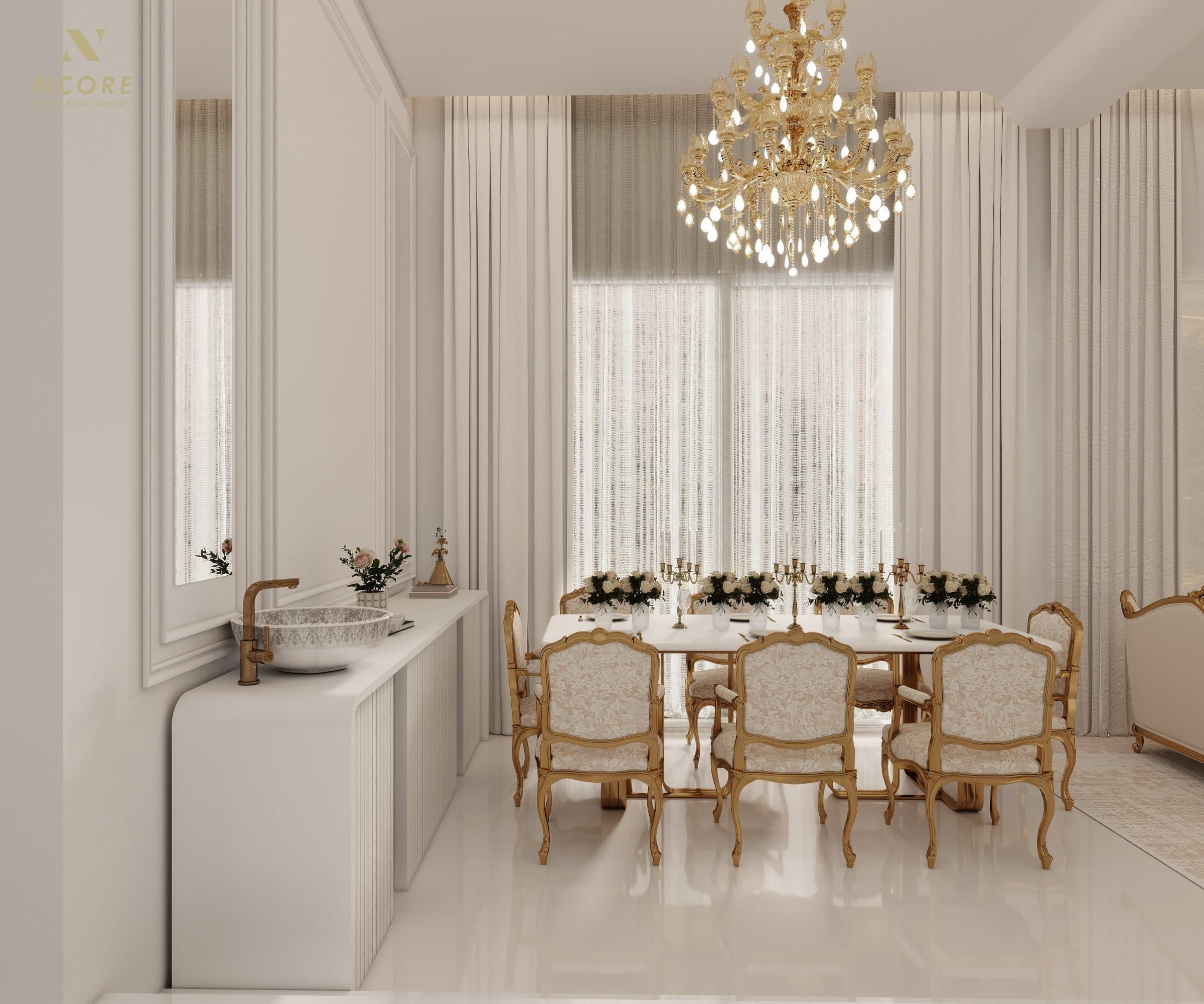 Dining room with gilt cabriole chairs under a crystal chandelier, the washbasin console along the near wall